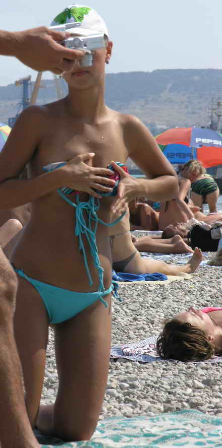 The beach photoshoot with a girl always slipping bra